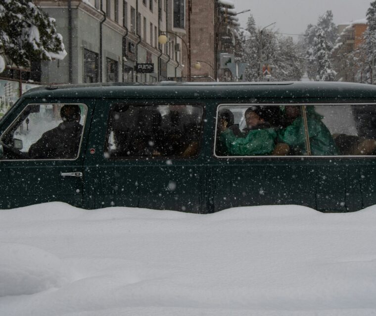 People in car in snow in Karabakh